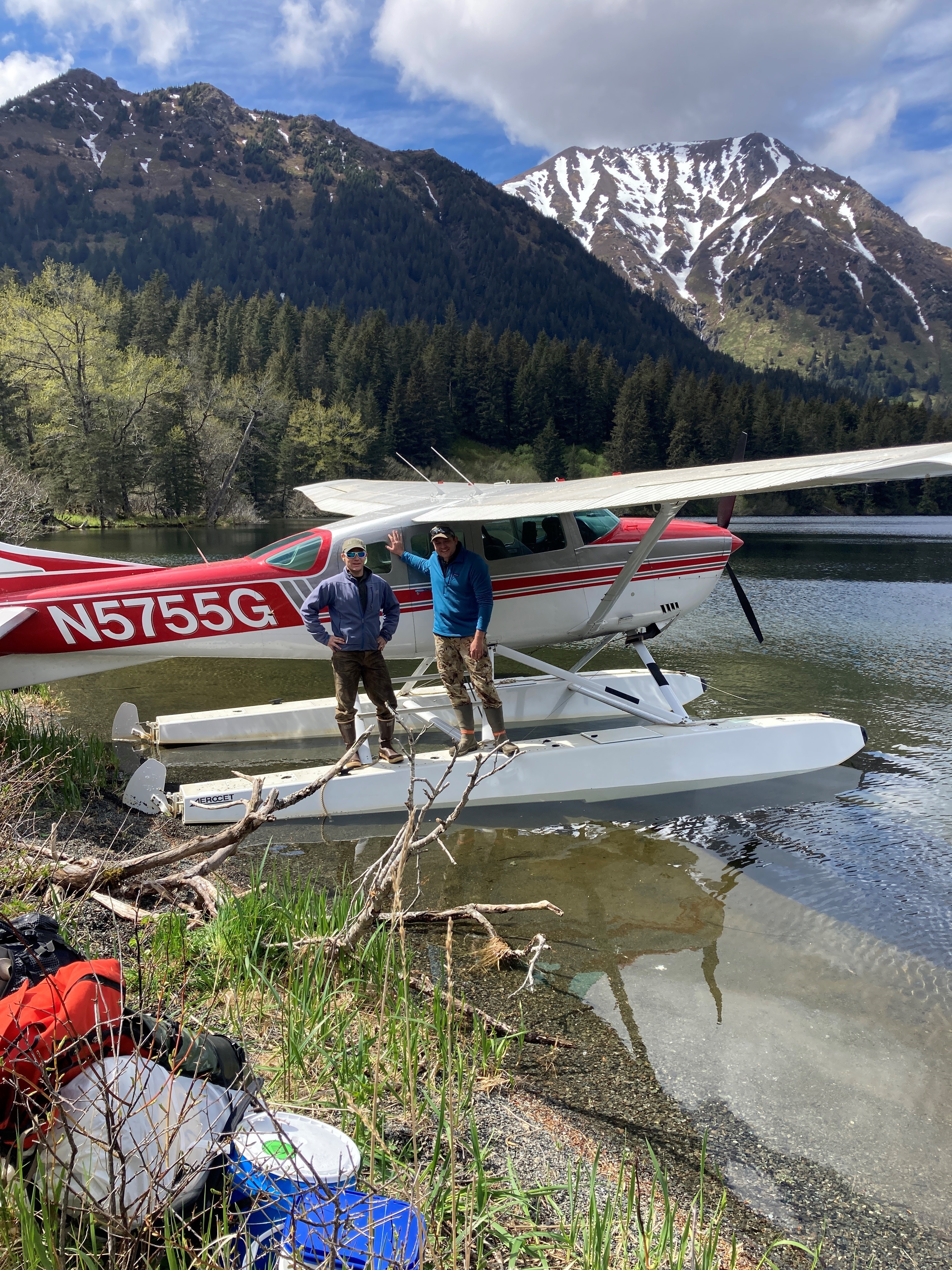 Alaskan Forester Nathan Lojewski with a sea plane.